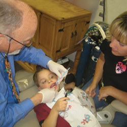 Kids Care Dental Elk Grove - Dr. Thompson engages mom and child in the work!