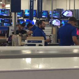 The con-artist himself.  Socializing, not working.