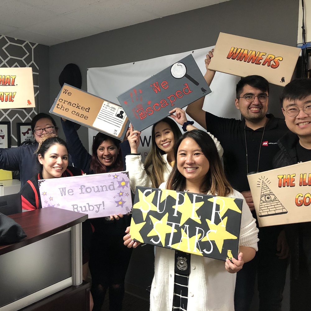 Puzzle Workshop: Escape Room - Our very excited group of seven after successfully solving the CSI: Hollywood room! (Please do not mind our eclectic choice in signs.) - Escape Games Near Me - Costa Mesa, California Puzzle Workshop: Escape Room - Our very excited group of seven after successfully solving the CSI: Hollywood room! (Please do not mind our eclectic choice in signs.) - Escape Games Near Me - Costa Mesa, California