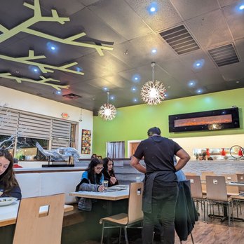 Noodle Wave - a man and a woman in a restaurant - Thai Near Me - Frisco, Texas Noodle Wave - a man and a woman in a restaurant - Thai Near Me - Frisco, Texas