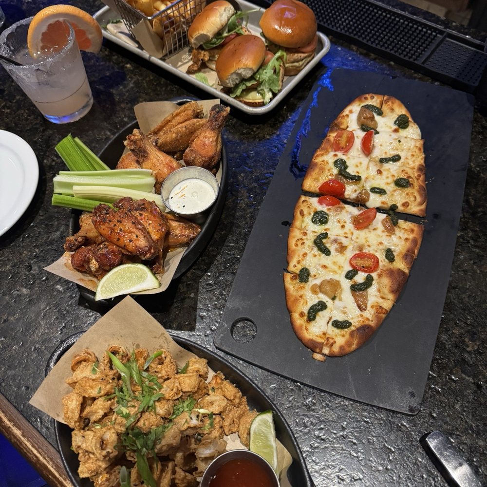 Bar Louie - Carmel - Thai Crispy Calamari & Wings bone Wings Bone-In Lemon Pepper/ Wings Bone In Thai & Margarita Flatbread & New Salmon Sliders - Bars Near Me - Carmel, Indiana Bar Louie - Carmel - Thai Crispy Calamari & Wings bone Wings Bone-In Lemon Pepper/ Wings Bone In Thai & Margarita Flatbread & New Salmon Sliders - Bars Near Me - Carmel, Indiana
