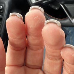 Legacy Salons & Day Spa - Nail glue left on the the fingers and he didn't grind under the nails.