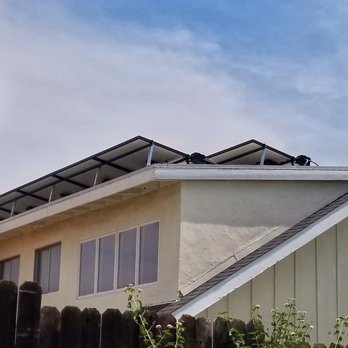 Jovic Construction - a house with solar panels on the roof - Solar Installation Near Me
