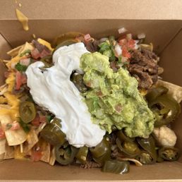 Their Asada Nachos delivered! Chips were still crunchy - too much sour cream though. Their Asada Nachos delivered! Chips were still crunchy - too much sour cream though.