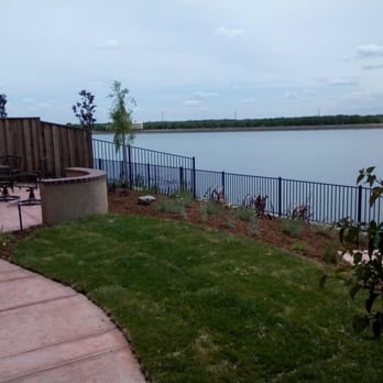 Sutton's Landscape & Maintenance - Short privacy/seating wall in patio area. - Landscaping Near Me Sutton's Landscape & Maintenance - Short privacy/seating wall in patio area. - Landscaping Near Me