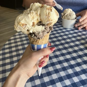 Boxcar Bakery and Ice Cream - Small waffle cone with ooey gooey butter cake on top of cookies and cream. - Ice Cream & Frozen Yogurt Near Me - Guthrie, Oklahoma Boxcar Bakery and Ice Cream - Small waffle cone with ooey gooey butter cake on top of cookies and cream. - Ice Cream & Frozen Yogurt Near Me - Guthrie, Oklahoma