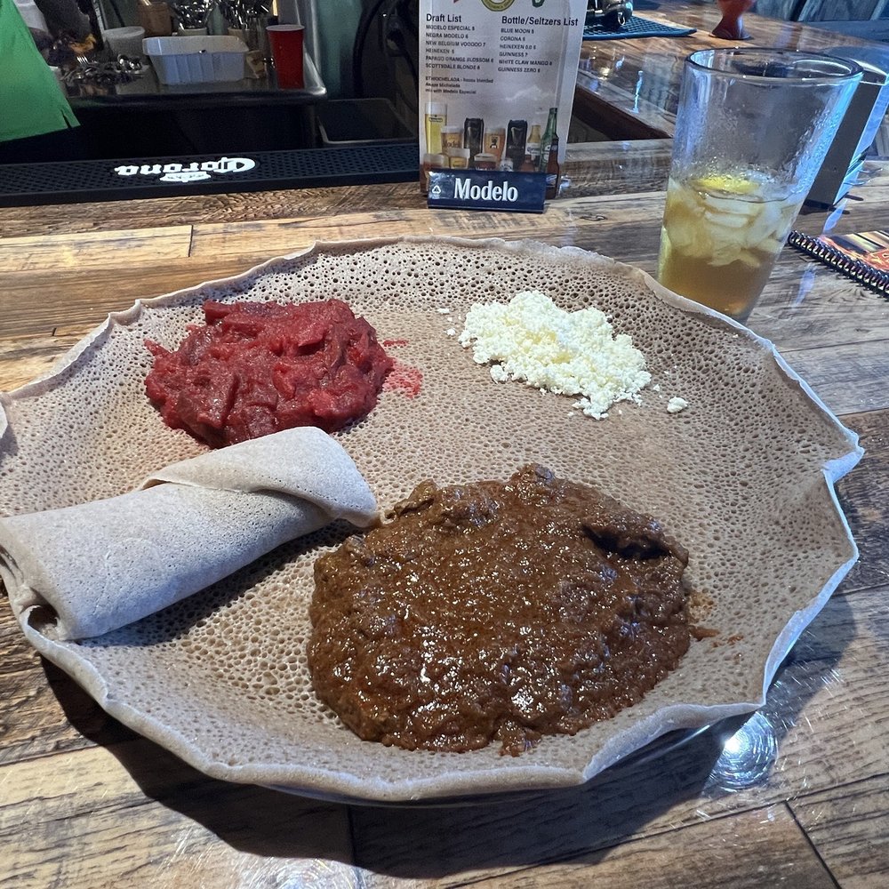 Authentic EthioAfrican - Meat & Veg Combo, Sega Wot Key beef, with Kyser (red beet and potato purée) on injera bread - Ethiopian Near Me - Scottsdale, Arizona