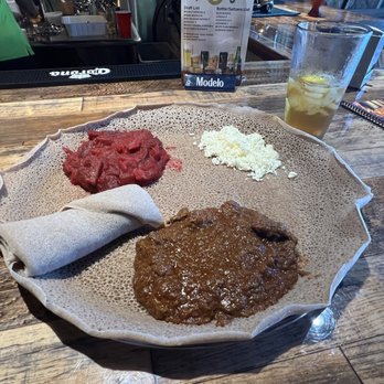 Authentic EthioAfrican - Meat & Veg Combo, Sega Wot Key beef, with Kyser (red beet and potato purée) on injera bread - Ethiopian Near Me - Scottsdale, Arizona