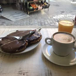 Palmier covered in chocolate over a hazelnut filling, latte and a freshly squeezed orange juice. Palmier covered in chocolate over a hazelnut filling, latte and a freshly squeezed orange juice.