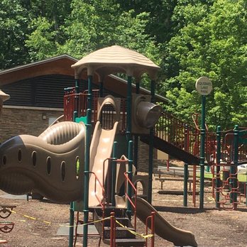 Squirrel Lake Park - Please ignore the puddles and tape. We are mid pandemic so playgrounds are closed, and this was taken 12 hours after a big storm - Parks Near Me - Matthews, North Carolina