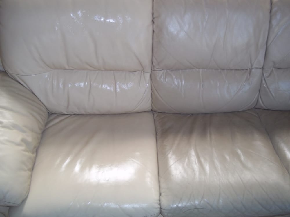 A White Protected Leather Couch Left Side Clean Right Side