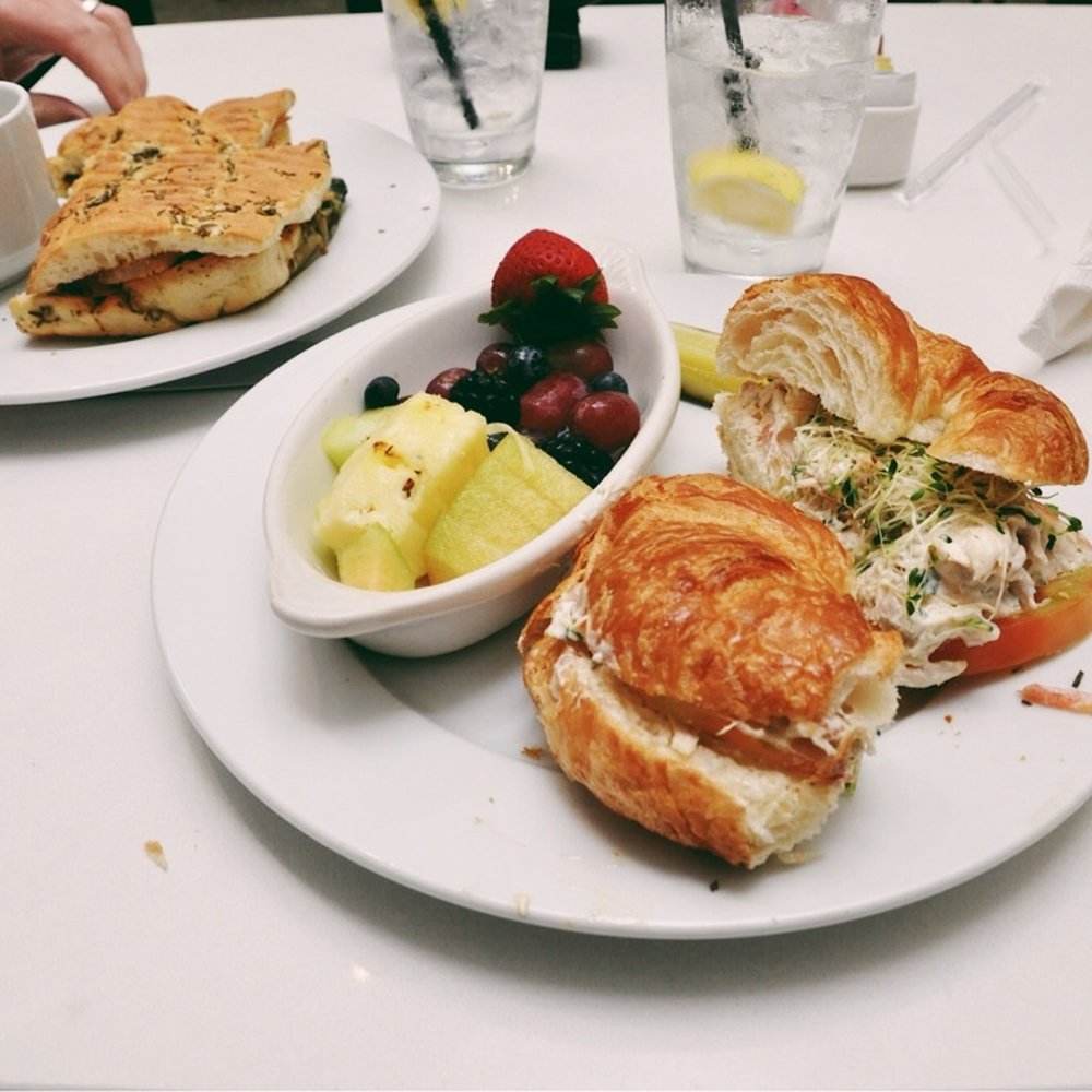 Blum & Co. - Chicken salad croissant with a side of fresh fruit - American Near Me - Galveston, Texas