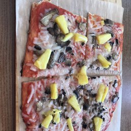 Vegan pizza with mushrooms and fresh pineapple Vegan pizza with mushrooms and fresh pineapple