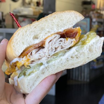 Mother Lode Market & Deli - a person holding a sandwich - Delis Near Me - Sutter Creek, California Mother Lode Market & Deli - a person holding a sandwich - Delis Near Me - Sutter Creek, California
