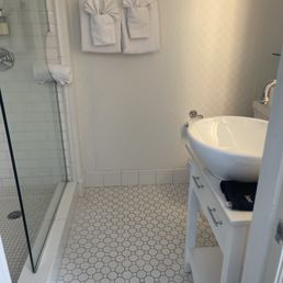 The bathroom had no counter space. I was forced to pile up my personal products on back of the toilet The bathroom had no counter space. I was forced to pile up my personal products on back of the toilet