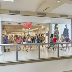 Deptford Mall - Shoppers walk past H&M and the H&M Kids section at Deptford Mall.