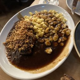 Beef topped with onions and spaetzel