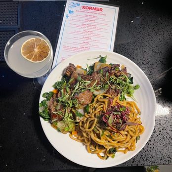 Korner Kitchen and Bar - China white, noodle belly, noodles, lomo saltado, braised greens - Kitchen Incubators Near Me - Oakland, California