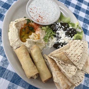 Greek Corner - Appetizer Sampler. Dolmades, pits and hummus, tzakik sauce, and Greek cheese sticks. - Greek Near Me - Bossier City, Louisiana Greek Corner - Appetizer Sampler. Dolmades, pits and hummus, tzakik sauce, and Greek cheese sticks. - Greek Near Me - Bossier City, Louisiana