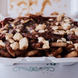 Cabane Chez Aline - 11$ for a huge poutine with a generous serving of toppings!