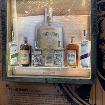 Boone County Distilling - A variety of their offerings, alongside a historic (empty) bottle of their whiskey. - Distilleries Near Me - Independence, Kentucky