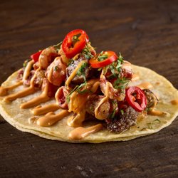 Taco Bamba Landmark - Taco with crispy beef tongue & tripa, chili aioli, pickled Fresno, grilled scallions.