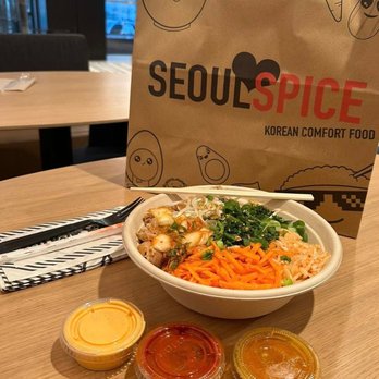 SeoulSpice - a bowl of noodles, carrots, and sauces - Korean Near Me - Arlington, Virginia