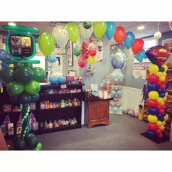 Candy Coach's Party Rentals - I am loving the balloons filled with presents!
