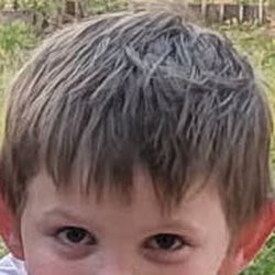 This is a cropped version of the full photo of my son I showed Marisa beforehand of how I would like his bangs trimmed.
