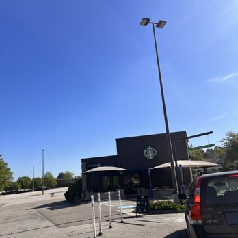 Starbucks - a car parked in a parking lot - Coffee & Tea Near Me - Augusta, Georgia