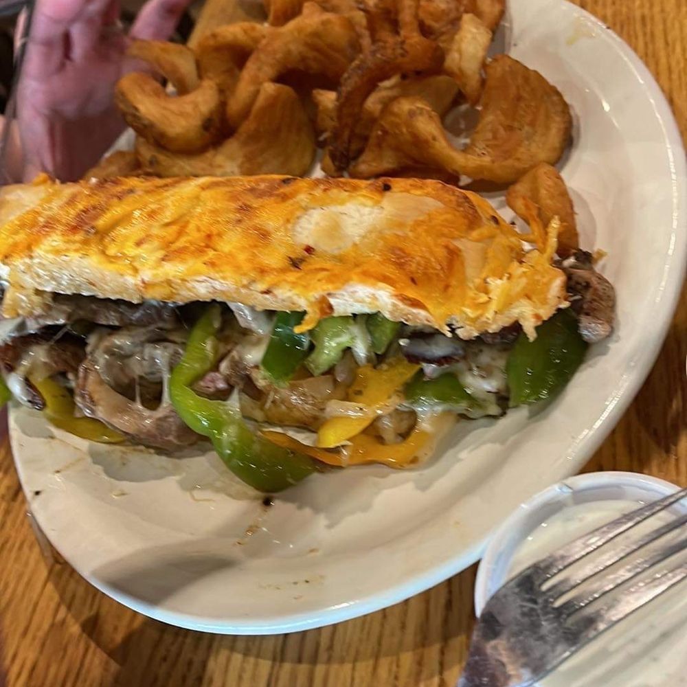 The Escondido Grill - Texas cheesesteak Sandwich with fries Chef's special of the day - Smokehouse Near Me - Lubbock, Texas The Escondido Grill - Texas cheesesteak Sandwich with fries Chef's special of the day - Smokehouse Near Me - Lubbock, Texas