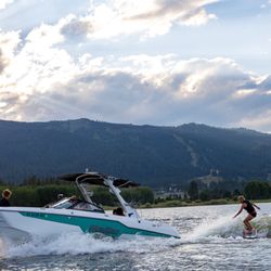 Tamarack Marina - A wake surfer follows behind a boat rental at The Marina at Tamarack Resort