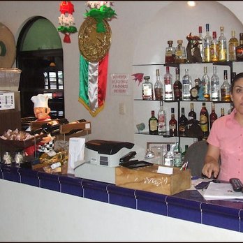 Langostino's - The restaurant manager, Edalia Benavides at the counter, as you enter the restaurant, and she provides a warm welcome for you as you walk in - Mexican Near Me - Ciudad Río Bravo, TAM