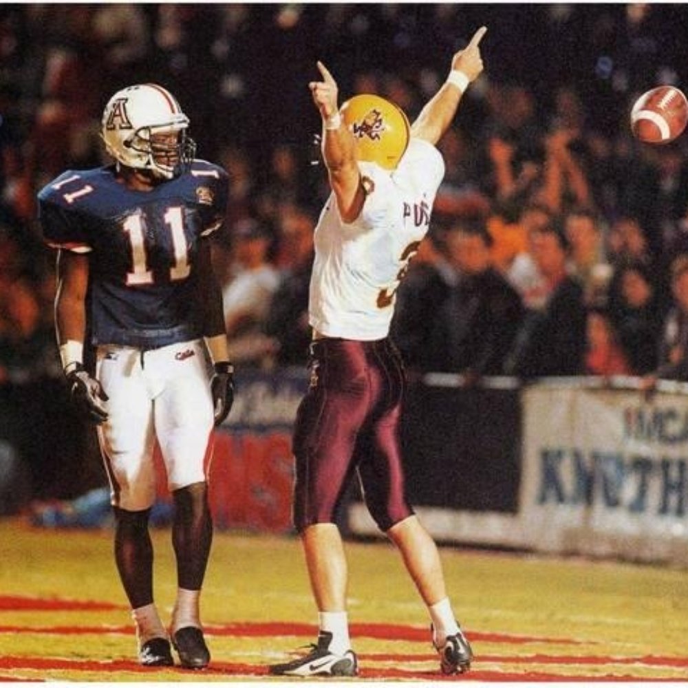 Mountain America Stadium - ASU receiver Keith Poole taunts a UofA defender after scoring a touchdown, during an emotionally charged rivalry game. - Stadiums & Arenas Near Me - Tempe, Arizona Mountain America Stadium - ASU receiver Keith Poole taunts a UofA defender after scoring a touchdown, during an emotionally charged rivalry game. - Stadiums & Arenas Near Me - Tempe, Arizona