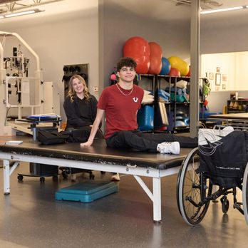 NextSteps Chicago - Patient and Therapist pose for a photo in between sets - Physical Therapy Near Me - Willow Springs, Illinois