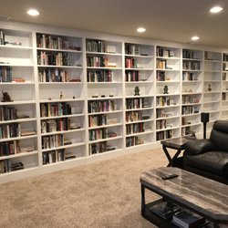 Denver Remodels - This book case is more than 25ft wide and more than 8 ft tall and Steve had no problems building it.