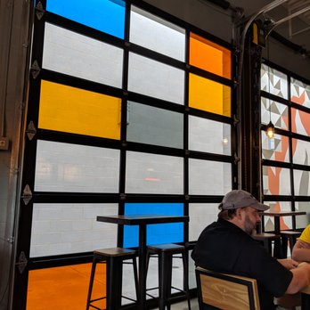 Blaze Pizza - Inside. Retractable doors with decorated windows. - Pizza Near Me - Atlanta, Georgia