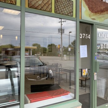 Patisserie Al Sham - the reflection of a car in the window - Desserts Near Me - Laval, Quebec Patisserie Al Sham - the reflection of a car in the window - Desserts Near Me - Laval, Quebec