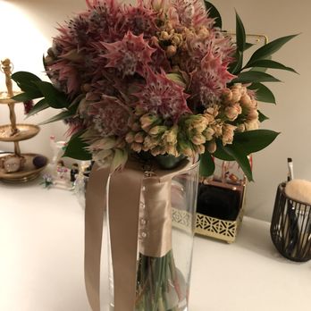 UrbanStems - Blushing Bride bouquet. I added the small pink flowers and greenery as fillers to make the bouquet look fuller along with the ribbon. - Florists Near Me