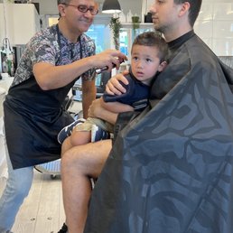 Juan cutting my son's hair