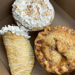 The Pie Sisters - Sour cream lemon hand pie, coconut cream pie and caramel apple pie.