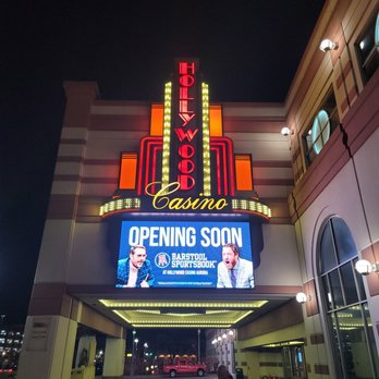 Hollywood Casino Aurora - a woman standing in front of the entrance - Casinos Near Me - Aurora, Illinois