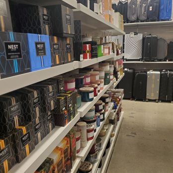 Nordstrom Rack - Retail store shelves display candles, gift boxes, and travel suitcases in various sizes and colors. - Shoe Stores Near Me - Clovis, California