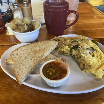 Two Chicks Cafe - Kickin chicken omelet with potatoes and toast. - Breakfast & Brunch Near Me - New Orleans, Louisiana