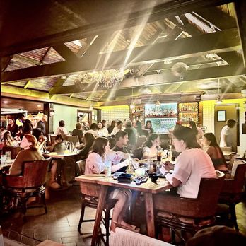 The Crouching Lion - Interior with pitched wood beamed ceilings - Beer Bar Near Me - Kaaawa, Hawaii