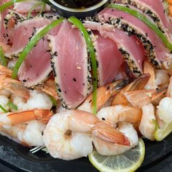 J&M Seafood - Delicious fresh seared sesame seed tuna & shrimp garnished with lemon and a soy sauce reduction