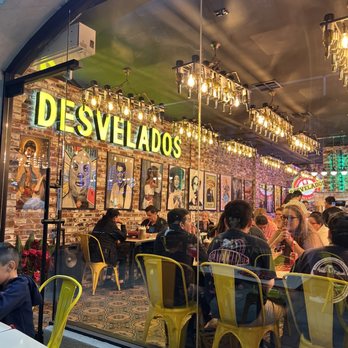 Desvelados - Entrance of Pasadena location. Beautiful frames of Mexico's golden era of artists. - Tacos Near Me - Pasadena, California