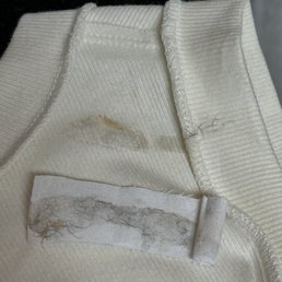 Wax stuck to my shirt, got home with this on me