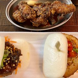 Bone Daddies - Two bao buns and chicken wings with pepper sauce.