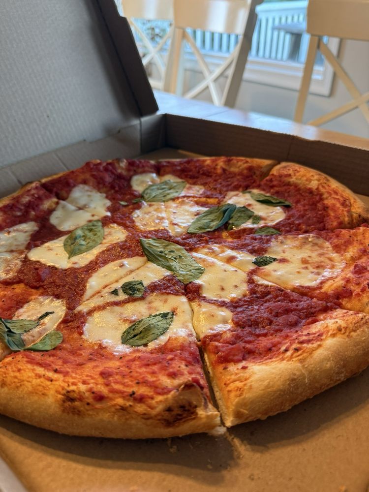 Corolla Pizza & Deli Logo